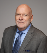 man smiling for professional head shot