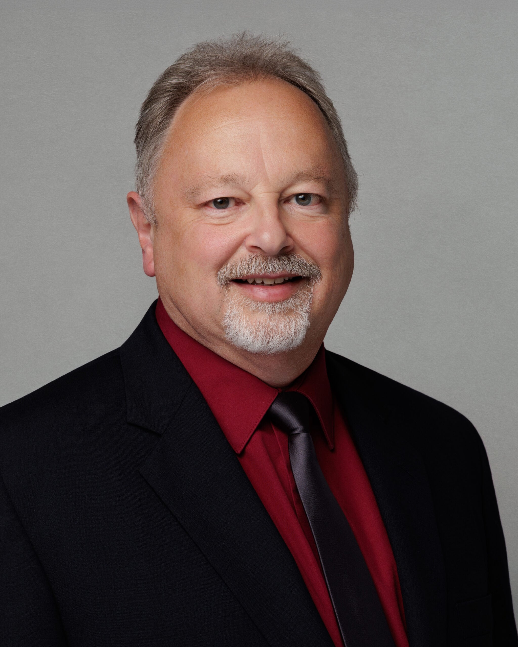 Man smiling for a professional photo